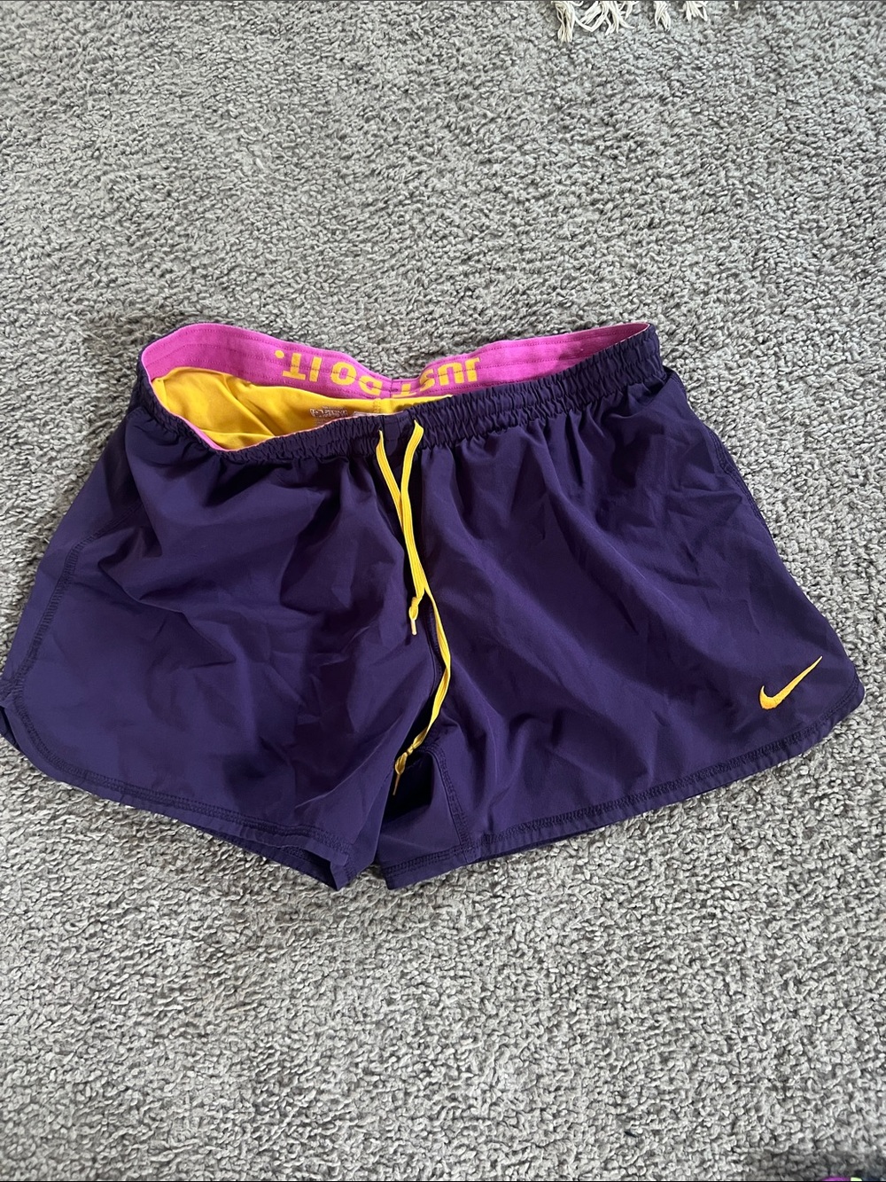 Nike Women's Purple Running Shorts with Yellow Details